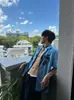Camisa de Manga Curta Azul Estilo Férias Estampa Ilha Gola Cubana Estilo Preguiçoso Nicho Casual Verão para Homens e Mulheres
