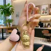 Shuibeizujin 20Mg Dorado Llavero de Dibujos Animados Princesa Por Favor Hazte Rica Labubu Cuentas de Corazón Accesorios de Cuerda de Cuero Regalo