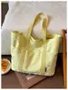 Bolsa de Ombro Único com Bordado de Laço 2026 Nova Outono/Inverno Grande Capacidade Bolsa Tote para Trabalho e Trajeto Bolsa de Braço da Moda para Mulheres