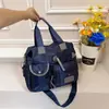Bolsa feminina transfronteiriça de grande capacidade 2026 Europeia e Americana, bolsa de maternidade, bolsa de ombro em tecido Oxford, bolsa de mão, bolsa de viagem, bolsa transversal