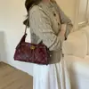 Bolso Pequeño Bordado Acolchado para Mujer 2025 Nueva Moda Tendencia Versátil Bolso de Hombro para Debajo del Brazo Popular Bolso Cubo