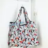Bolsa de compras de dibujos animados directa de fábrica Snoopy jingle plegable bolsa de protección ambiental poliéster grande dos en uno bolsa de compras