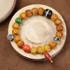Pulsera Wen play talla en hueso de yak pulsera de semillas de pasión accesorios de Tianzhu del Tíbet imitación Qiu Jiao Huang Caishen joyería al por mayor