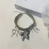Collar con colgante de mariposa de metal y cuentas para mujer, diseño de nicho de lujo ligero, collar de cadena para clavícula multicapa, nuevo 2024