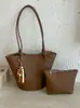 Bolso de cubo de nicho transfronterizo para mujer, nuevo bolso de mano versátil de moda 2026 con patrón de lichi, bolso de hombro cruzado