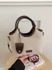 Bolso de gamuza para mujer 2026 nuevo bolso de mano pequeño de verano para el trabajo, bolso tipo cubo Maillard de un solo hombro cruzado