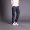 Pantalones de trabajo para exteriores estilo americano para hombre, adecuados para primavera y otoño, diseñados para senderismo y montañismo, con un corte holgado y recto, duraderos y con múltiples bolsillos, lo que los convierte en pantalones largos casuales