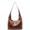 Bolsa feminina de venda quente transfronteiriça com logotipo estampado personalizado, bolsa tote retrô para o dia a dia, grande capacidade, cor sólida, bolsa transversal versátil de PU para mulheres