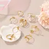 Diseño de Nicho Europeo y Americano Exquisito Anillo Abierto de Acero Inoxidable con Flor y Perla Chapado en Oro de 18K Anillo Abierto al por Mayor