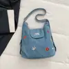 Bolsa de mezclilla multifuncional bordada con cachorro lindo 2026 nueva mochila/bolso de hombro casual de nicho de moda