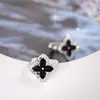 Bestseller transfronterizo: Exquisitos pendientes de botón de circón de trébol con diseño único, de lujo ligero y estilo elegante para mujer