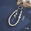 Nuevo colgante de manzana y mariposa con cuentas hecho a mano para teléfono, con un toque de alta gama, charm de cadena doble para bolso, cadena para colgar el teléfono, regalo