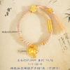 Jin Yan no se ha desvanecido en mucho tiempo.. Vietnam Sha Jin patrón martillado viento Xizang moneda enrollada calabaza Fulu pulsera tejida a mano con cuerda de colores