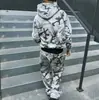 Comercio exterior Europeo y Americano AliExpress estampado de camuflaje estilo pareja moda urbana de moda suéter sudadera holgada y pantalones casuales de pierna ancha