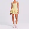 Falda corta de tenis sin espalda estilo europeo y americano, tacto nude, ajustada, anti-exposición para mujer, nueva falda corta transfronteriza para correr al aire libre, fitness, yoga