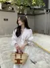 Camisa con cordón estilo coreano de nicho Ins2026 Dongdaemun, nueva para primavera, ligeramente transparente, protección solar, top para mujer