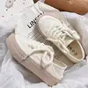 Sapatos brancos finos de verão para mulheres 2023 novos sapatos de lona respiráveis com sapatos de saia meias chinelos slip-on sapatos femininos
