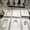Venta al por mayor del fabricante Inodoro de sentarse Cerámica de pared Inodoro de sentarse Inodoro para casa de alquiler Inodoro doméstico de sentarse