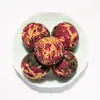 Té aromático de bola de dragón Pu'er hecho a mano de Yunnan transfronterizo té de bola de dragón de jazmín venta al por mayor té aromático de bola de dragón flor de rosa y peonía