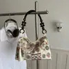 Bolso pequeño bordado de estilo étnico para mujer, nuevo modelo 2026, nuevo estilo chino, bolso cubo de estilo nacional para el día a día, bolso de mano moderno y versátil