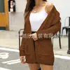 Cárdigan de punto trenzado liso para otoño e invierno transfronterizo europeo y americano, abrigo casual holgado con bolsillos, cárdigan de longitud media para mujer