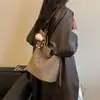 La popular bolsa de axila de este año es la nueva moda de verano 2026, tejida, elegante, de gran capacidad, para el hombro y cruzada