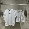 Marca de moda estilo americano SYNA WORLD Traje de manga corta estilo taladro High Street Hip Hop Ins Verano Pantalones cortos casuales para hombres y mujeres