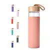 Botella de Vidrio Borosilicato de Grado Alimenticio Más Vendida en Amazon Diámetro Grande Tapa de Bambú Vaso Portátil para Beber con Funda de Silicona de Colores