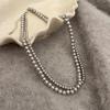 Collar de perlas grises Shijia para mujer, cadena de clavícula de temperamento de alto grado con diseño de nicho de lujo ligero, nueva cadena de suéter retro