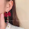 Brincos de meteoros rotativos Outono e inverno Ano Novo Brincos de laço vermelho Design de nicho doce Sense Ear Clip Mulheres