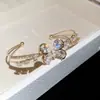 Pulsera abierta de doble capa con mariposa de circón, moderna, simple, dulce, exquisita, versátil, lujo ligero, joyería de alta gama para mujer
