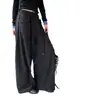 Pantalones anchos de pierna ancha, corte holgado, estilo coreano de alta costura para mujer, colección otoño 2026, con cintura de cordón, bolsillos grandes y un diseño relajado hasta el suelo.