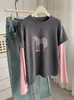 Camiseta de Manga Larga con Bloques de Color de Pony de Dibujos Animados para Mujer, Nueva Moda Versátil Elegante de Principios de Primavera 2026