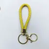 Venta al por mayor del fabricante Llavero de Cuerda de Aleación Tejida y Cuero Accesorios Colgantes Material PU Bolsas Pequeñas de Regalo Accesorios para Llaveros