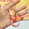 Chaveiros de letra com pompom estilo europeu e americano, chaveiros de letra em formato de coração de resina de cristal para meninas