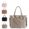 Bolso tote con lazo en stock, bolsa de yoga, nueva bolsa cuadrada bordada estilo invierno, bolso de hombro tote acolchado de algodón