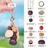 Colgante de Fruta Negra Indonesia de Cáscara Natural, Adorno Tradicional de Cáscara de Fruta Nativa, Accesorio para Colgar en el Coche, Accesorio para Colgar en la Bolsa, Suministro Directo desde la Fábrica Fuente