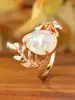 Anel bestseller transfronteiriço em ouro rosé com ramo e gota d'água opala branca, anel vintage oco floral com opala
