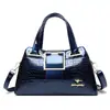 Bolsa feminina 2024 nova bolsa para mulheres de meia-idade simples atmosfera bolsa de ombro mensageiro moda comércio exterior portátil bolsa de mãe atacado