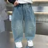 Pantalones Vaqueros de Primavera y Otoño para Niños Estilo Coreano Infantiles Elegantes Versátiles de Corte Curvo Holgados Modernos Largos para Niños Pequeños Comercio Exterior