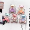 Lentejuelas de impresión de superficie de corte Accesorios de oso Joyería DIY Material de resina Funda para teléfono móvil Accesorios de pegamento de crema Accesorios de hebilla de zapato