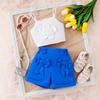 Verano 2025 Europa y Estados Unidos nuevo traje para niña niños color liso flor top sin mangas pantalones cortos outlet de fábrica
