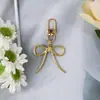 Luxo Leve Estilo Coreano Liga de Resina Pérola Corrente Pendurada Corrente de Celular Chaveiro de Carro Decoração de Bolsa Pulseira de Pulso Moderno e Versátil