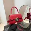 Bolso pequeño portátil con hebilla de moda 2025 nuevo nicho textura simple bandolera tendencia casual todo-partido bolso mensajero