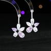 Estilo de lujo ligero pendientes de moda de alta calidad al por mayor diseño de incrustaciones de circonita brillante pendientes de flor irregulares geométricos