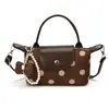 Bolso de mano de lunares para mujer estilo europeo y americano, estilo coreano, lujo de nicho, bolsa tote versátil y elegante para ir al trabajo, bolso de hombro y bolso cruzado