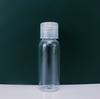 Botella de spray de 30 ml productos para el cuidado de la piel subenvasados fina niebla pulverización lateral botella de muestra transparente fabricantes de botellas flip venta al por mayor