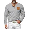 Camisa Henley de pana tejida transfronteriza para hombre 2026, tres botones, media tapeta, bloques de color, bolsillo de parche, manga larga