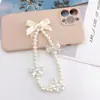 Cordón para teléfono móvil con forma de corazón y lazo de perla para niña, cadena de cuentas hecha a mano, colgante corto en forma de U para mujer