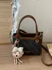 Bolsa balde feminina de mão transfronteiriça 2026 design de nicho retrô nova tendência simples casual bolsa de ombro transversal